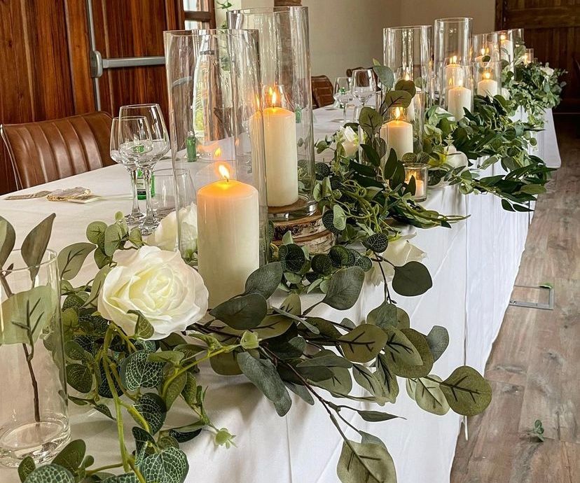Wedding top table foliage styling with candles venue dressers Cheshire